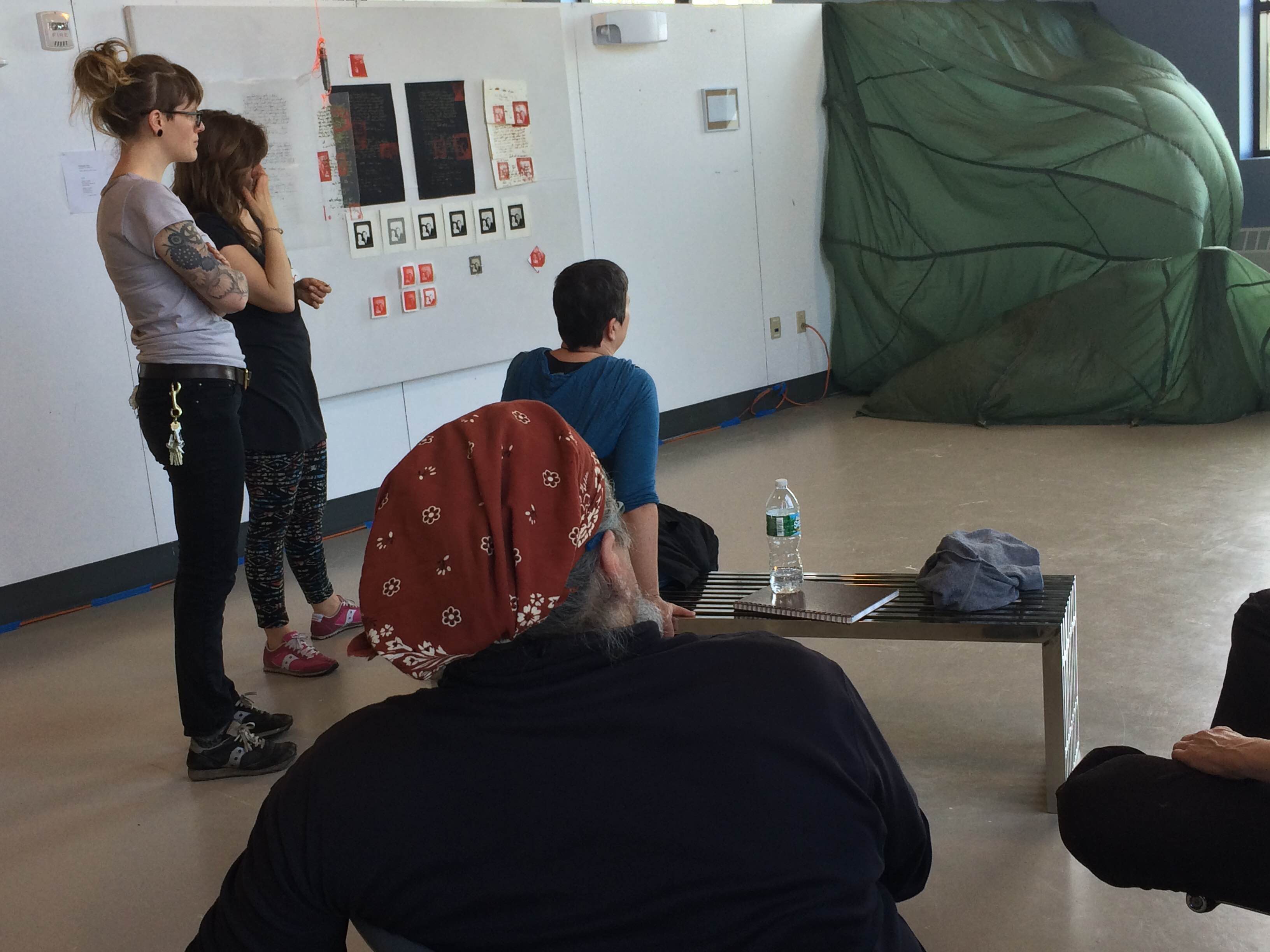 MFA students discussion work in a studio critique.