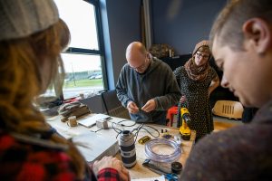 Students and faculty work together in a workshop on creation of biodigesterss