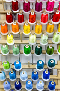 Photo of colored bobbins from Textle lab