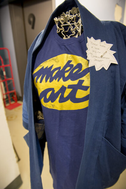 photograph of art installation or a T-shirt with the slogan "Make Art" on it.