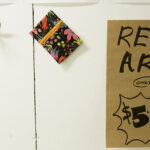 An image of a sign reading Real Art five dollars