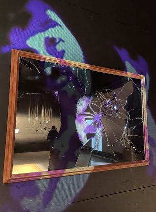 Close up of James LeBlanc's projection project onto shattered mirror